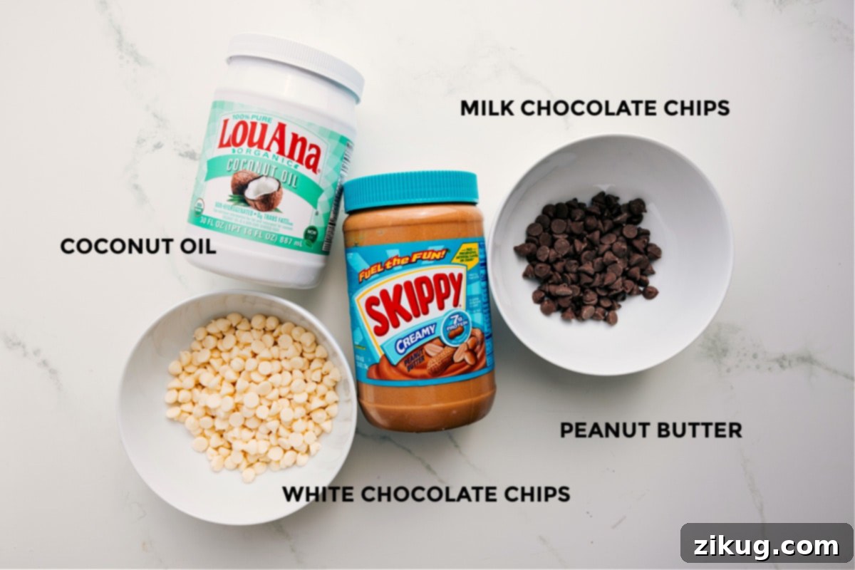 Essential Ingredients for Peanut Butter Meltaways All the essential ingredients for making Peanut Butter Meltaways, prepped and ready for easy assembly: white chocolate chips, milk chocolate chips, creamy peanut butter, and coconut oil.