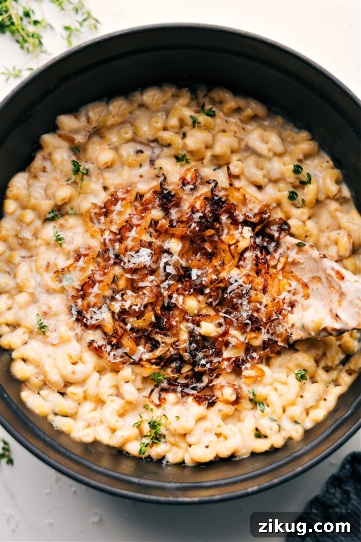 The Ultimate Comfort Food: French Onion Mac And Cheese - A Delicious Fusion Recipe A large pot filled with creamy French Onion Mac And Cheese, ready to be served.