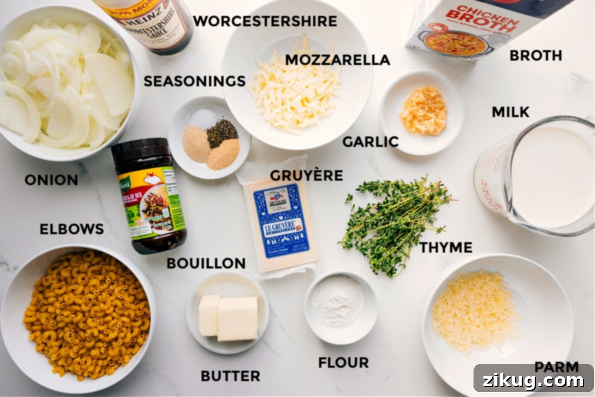 Key Ingredients For The Best French Onion Mac And Cheese All the prepped ingredients for French Onion Mac And Cheese laid out: thinly sliced onions, elbow macaroni, Worcestershire sauce, beef bouillon, butter, grated mozzarella, minced garlic, grated Gruyère, all-purpose flour, fresh thyme sprigs, grated Parmesan, whole milk, and chicken broth.