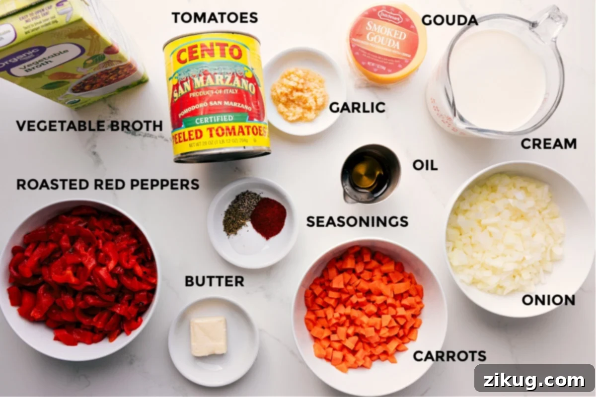 Ingredients In Roasted Red Pepper Gouda Soup All the ingredients for Roasted Red Pepper Gouda Soup prepped out for easy assembly, including broth, red peppers, tomatoes, seasonings, butter, oil, garlic, gouda, cream, onion, and carrots.