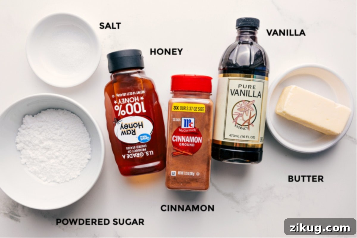 Key Ingredients for the Best Honey Butter Recipe All the essential ingredients for honey butter, including room temperature butter, powdered sugar, golden honey, vanilla extract, ground cinnamon, and a pinch of salt, neatly laid out for easy preparation.