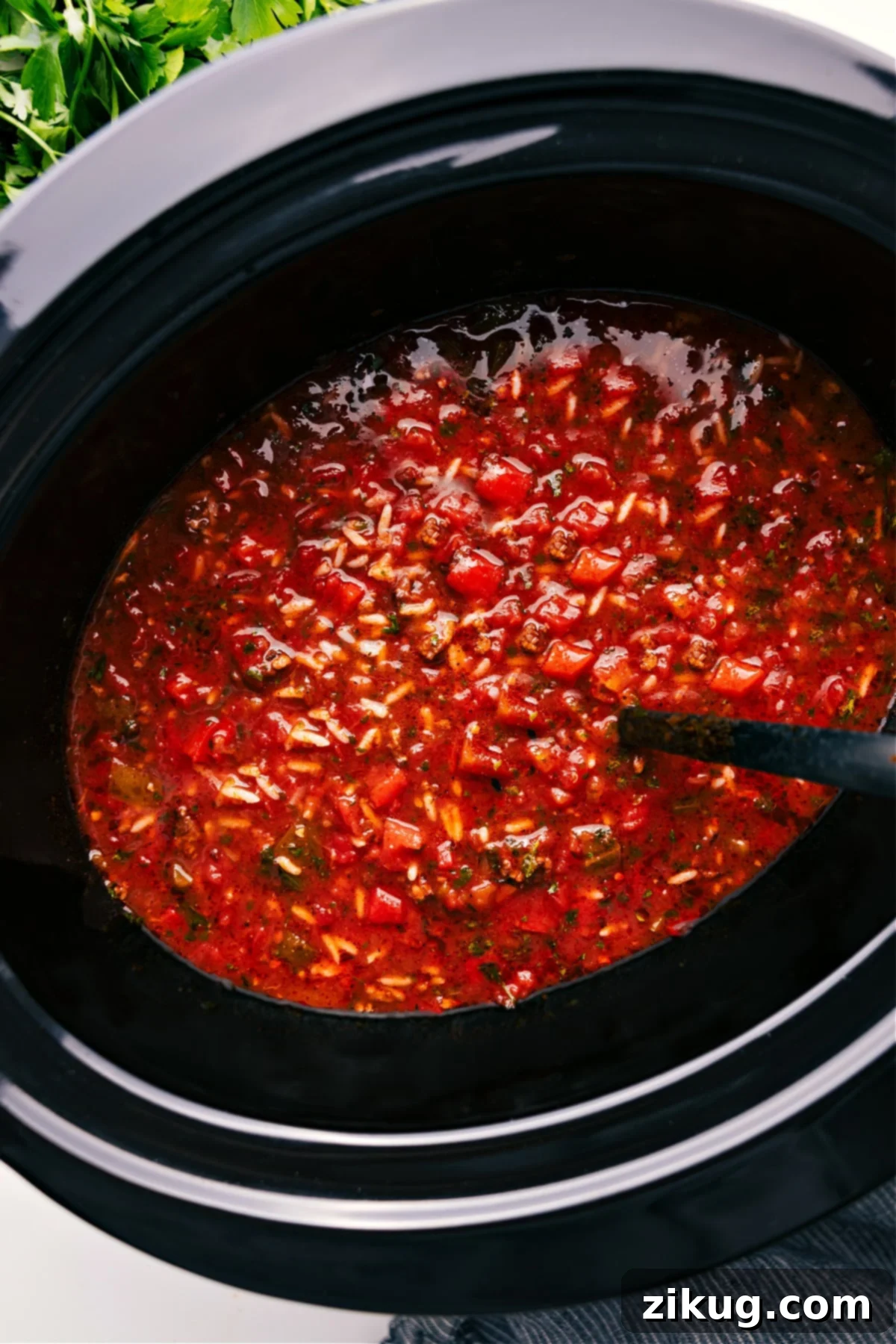 Crockpot Stuffed Pepper Soup In The Slow Cooker: A Warm and Inviting Meal Hearty Crockpot Stuffed Pepper Soup, still bubbling in the slow cooker, ready to be served and enjoyed by the family.