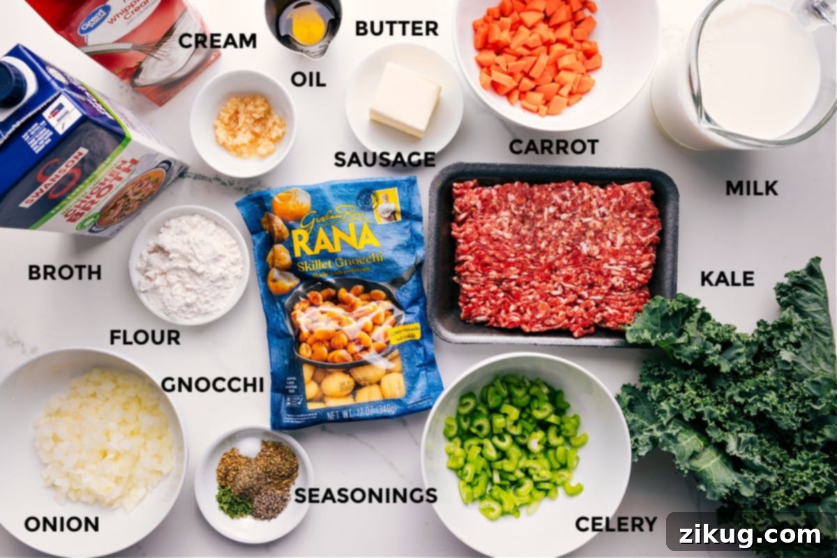 Ingredients In Sausage Gnocchi Soup All the ingredients in this recipe prepped out for easy assembly including the broth, cream, flour, onion, gnocchi, seasonings, celery, kale, milk, carrot, sausage, butter, and oil, arranged for a clear visual guide.