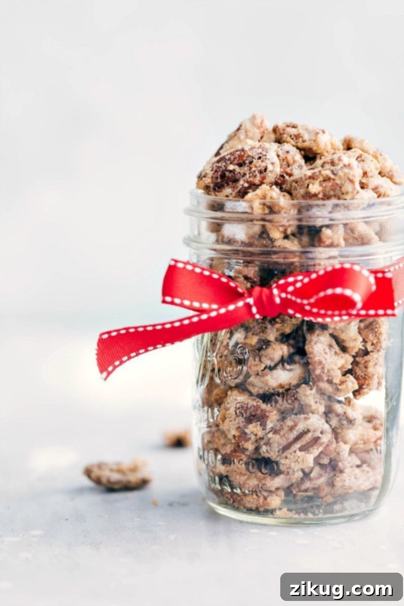 Gift This Candied Pecans Recipe A beautifully presented mason jar, brimming with delicious candied pecans and adorned with a simple, elegant ribbon, perfect for gifting.