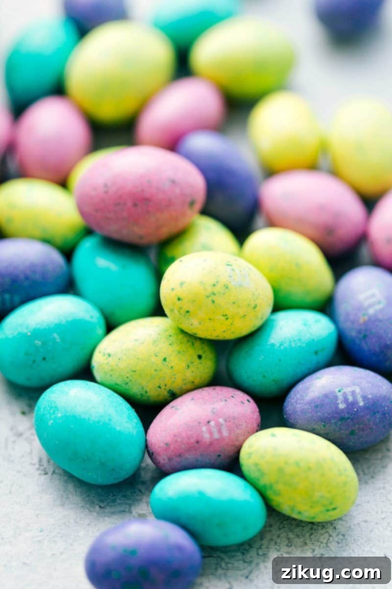 Close up shot of speckled egg M&Ms, perfect for Easter cupcake decorations.