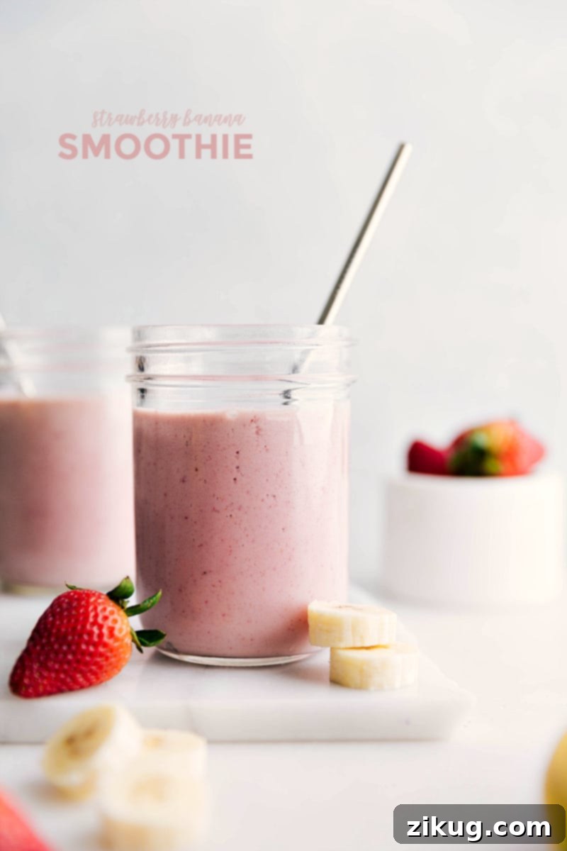 Discover how to make the ultimate Strawberry Banana Smoothie with just five simple ingredients: frozen strawberries, frozen banana, milk, Greek yogurt, and a touch of honey. This healthy, filling, and incredibly flavorful smoothie comes together in mere minutes for a quick and easy fruit-packed delight. A vibrant, thick Strawberry Banana Smoothie in a glass, garnished with fresh fruit, ready to be enjoyed.
