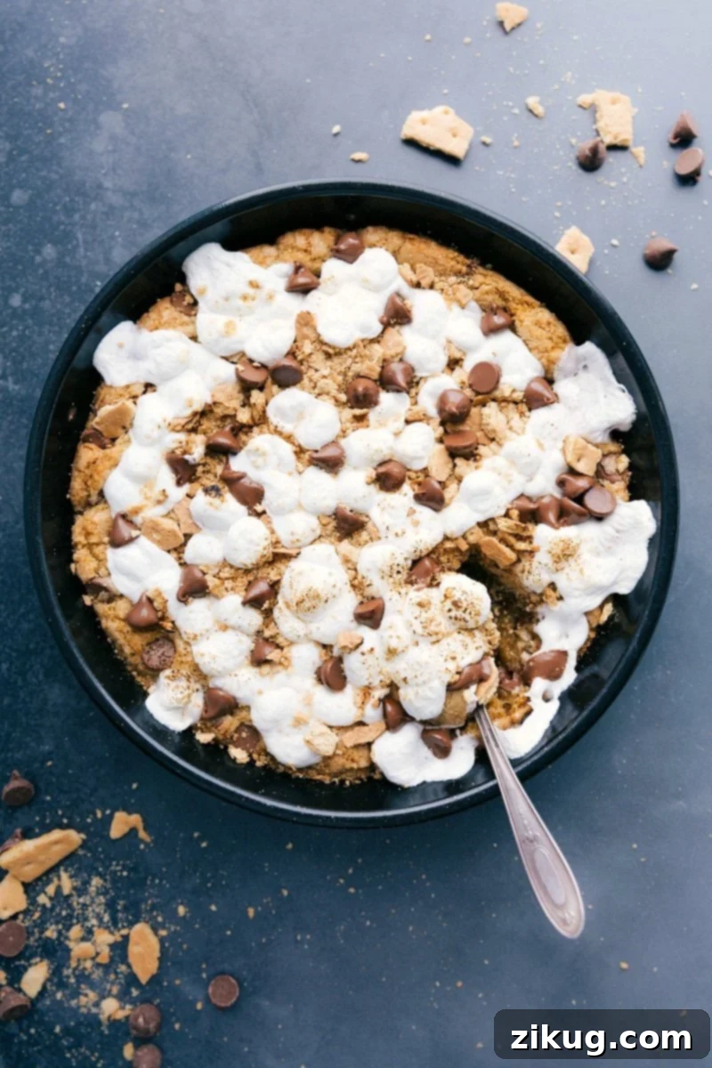 Enjoy the Sweetness: Freshly Baked S'mores Pizookie Ready to Delight Freshly baked s'mores pizookie, warm and gooey, inviting a sweet dessert indulgence.