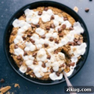 Freshly baked s'mores pizookie, warm and gooey, inviting a sweet dessert indulgence.