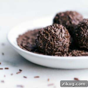 A plate of traditional Brigadeiros covered in chocolate sprinkles.
