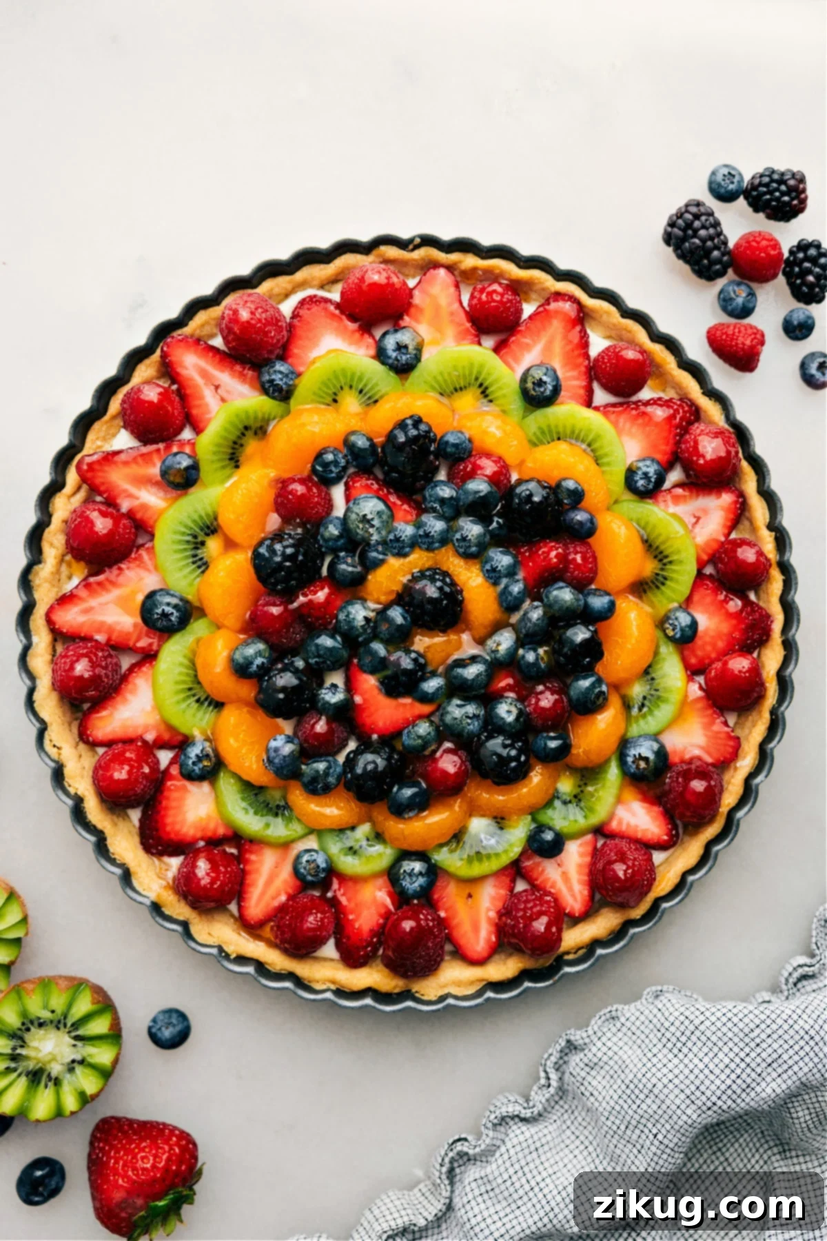 A stunning Fruit Pizza Recipe with a glossy sweet glaze and colorful fresh fruit toppings—perfect for slicing and enjoying!