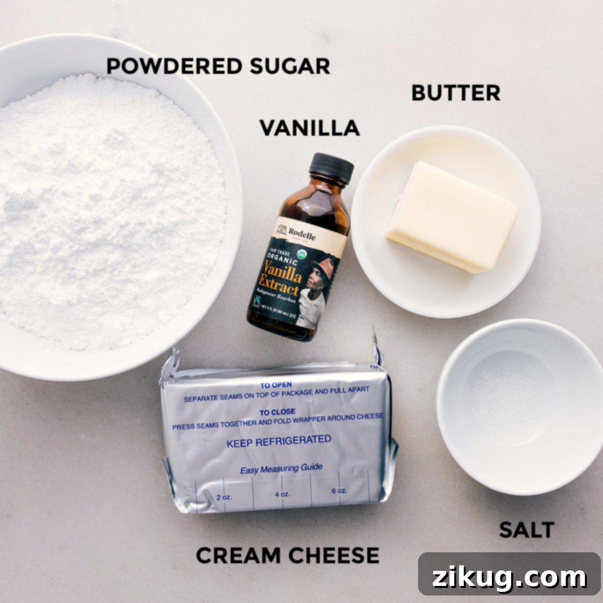 All the cream cheese frosting ingredients meticulously prepped and ready for easy assembly of this delicious fruit pizza recipe.