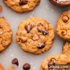 A stack of healthy peanut butter breakfast cookies, garnished with sea salt flakes.