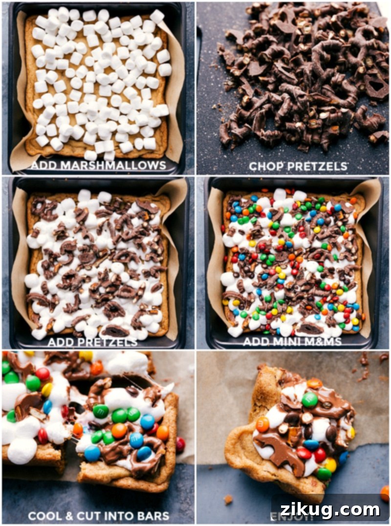 Overhead view of a baking pan filled with golden-brown cookie bars, being decorated with a vibrant array of mini M&M's, chocolate-covered pretzels, and colorful sprinkles, creating a playful and tempting dessert ready for the final touch.