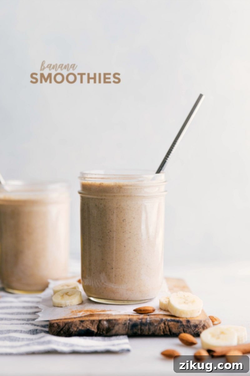 Delicious Banana Smoothie Two glasses filled with creamy banana smoothie, garnished with banana slices and a sprinkle of cinnamon.