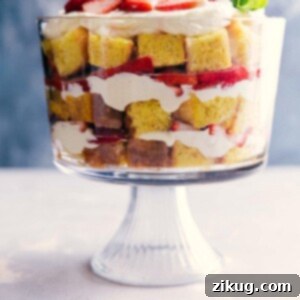 Strawberry shortcake trifle with layers of cake, fresh strawberries, and cream.