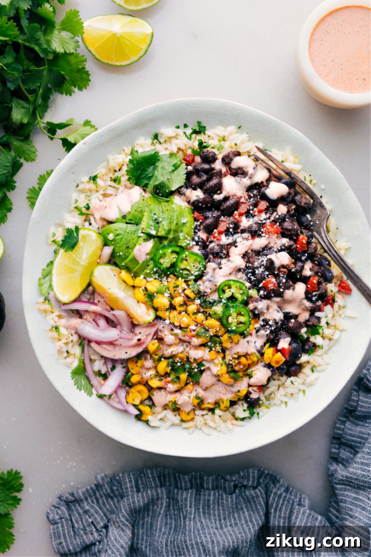 Delicious Black Bean Burrito Bowls Black Bean Burrito Bowls ready to be enjoyed! A vibrant and colorful plant-based meal.