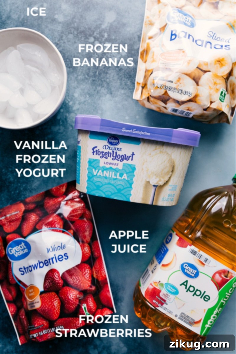 Key ingredients for Jamba Juice Strawberry Wild copycat: Apple juice, frozen strawberries, frozen banana, ice, and frozen vanilla yogurt for a perfectly balanced and thick smoothie. A vibrant flat lay of fresh and frozen ingredients laid out for making the Jamba Juice Strawberry Wild smoothie, including apple juice, frozen strawberries, frozen banana, and frozen vanilla yogurt.