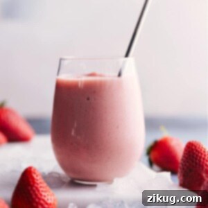 Jamba Strawberry Wild Blast 2 Jamba Juice Strawberry Wild smoothie in a glass with a straw.