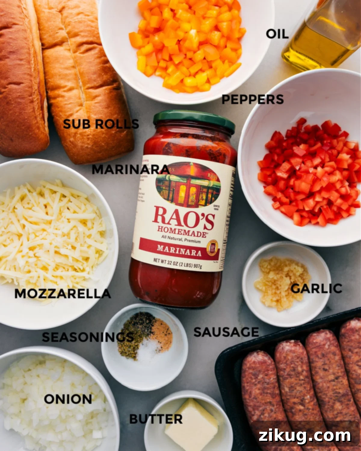 Ingredients In Italian Sausage Sandwich All the fresh ingredients meticulously prepped for the Italian Sausage Sandwich recipe, including colorful bell peppers, sturdy hoagie rolls, rich marinara sauce, shredded mozzarella, diced yellow onion, aromatic seasonings, ground Italian sausage, minced garlic, and softened butter.