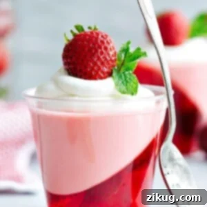 A beautifully presented Strawberry Jello Parfait Cup, ready to be enjoyed.