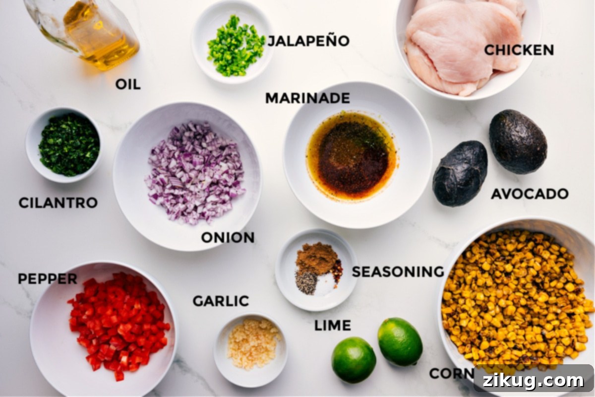 All the ingredients for this recipe are prepped and ready for easy assembly, including the meat, jalapeño, marinade, onion, seasonings, corn, lime, garlic, pepper, cilantro, and oil.