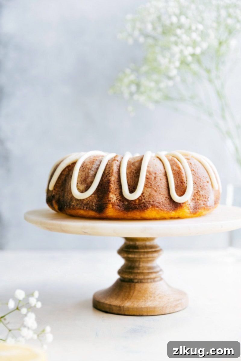Glazed Lemon Bundt Delight 2 A beautifully glazed and frosted lemon bundt cake, showcasing its moist texture and vibrant yellow color, ready to be served. This is the ultimate lemon bundt cake with delicious lemon buttercream frosting.