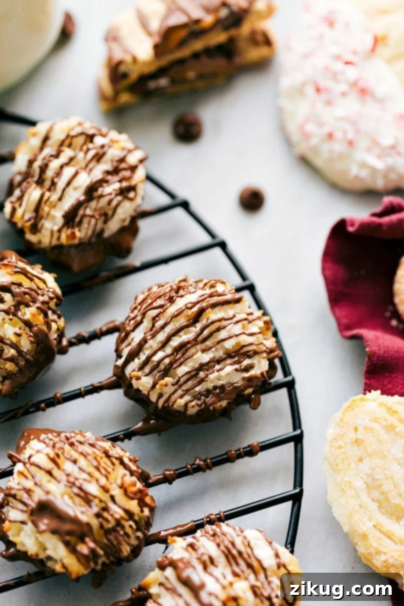 Delicious 3-ingredient Coconut Macaroons Christmas cookies! PLUS two free printables to festively package up these cookies! Recipe via chelseasmessyapron #holidays #chocolate #best #quick #easy #simple #3ingredients #christmas #cookies Overhead image of the macaroons, some dipped in chocolate