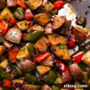 A delicious serving of One Pan Breakfast Potatoes and Bacon, garnished with fresh parsley.