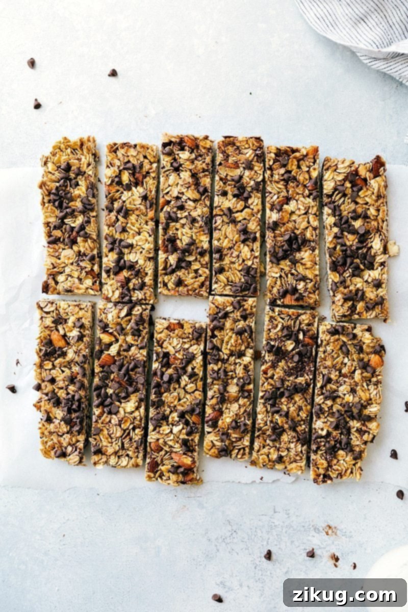 Homemade Granola Bars with Chocolate Chips - Ready to Eat Delicious homemade granola bars, generously studded with chocolate chips, perfectly cut into individual portions, and artfully arranged, ready to be savored.