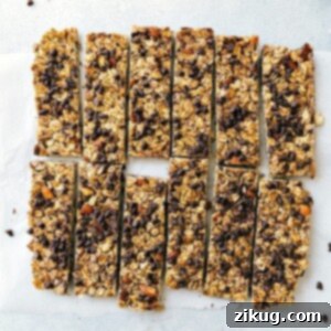 Wholesome Energy Granola Bars 3 Delicious homemade granola bars, full of chocolate chips, cut into portions, and ready to be enjoyed.