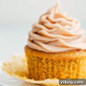 Ready to eat delicious pumpkin cupcake with a cinnamon cream cheese frosting, a perfect fall treat.