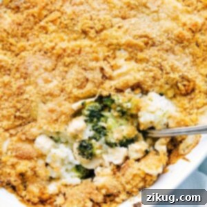 Close-up of a bubbling Chicken Broccoli and Cheese Rice Casserole, topped with crispy crackers.