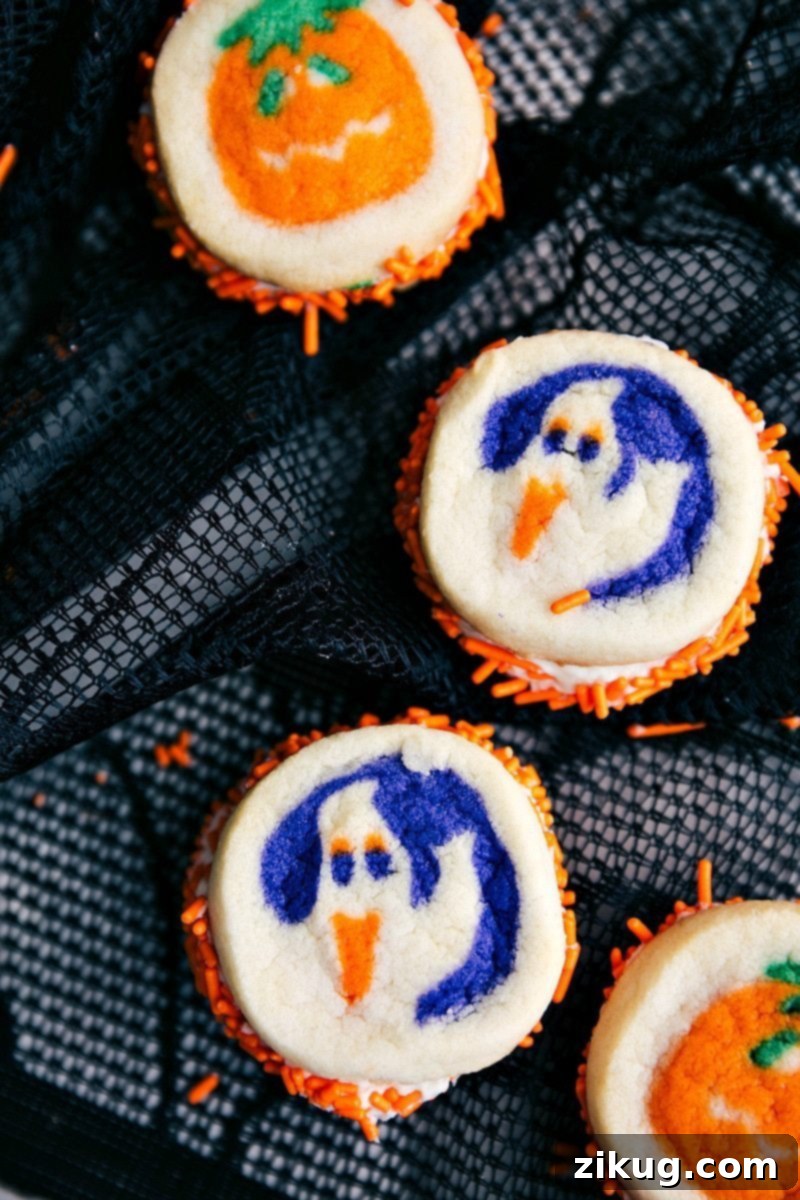 Image of 4 double-sided Halloween cookies featuring pumpkins and ghosts, great with other Halloween treat ideas
