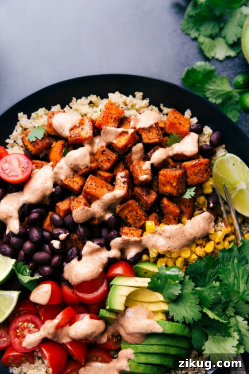 Sweet Potato Power Bowl 6 An inviting overhead shot of five vibrantly colored and fully assembled sweet potato taco bowls, ready to be enjoyed.