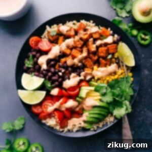 Sweet Potato Power Bowl 7 A finished sweet potato taco bowl with all ingredients beautifully arranged and a side of fresh lime.