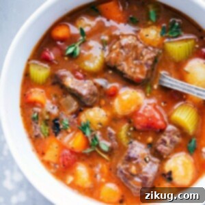 Hearty Slow Cooker Beef Stew 3 A steaming bowl of Crockpot Beef Stew with Gnocchi