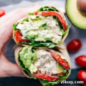 Zesty Chicken Roll-Up 3 Chicken Salad Wrap cut open to show the interior.
