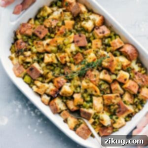 A dish of Thanksgiving dressing with a golden-brown top, ready to be served.