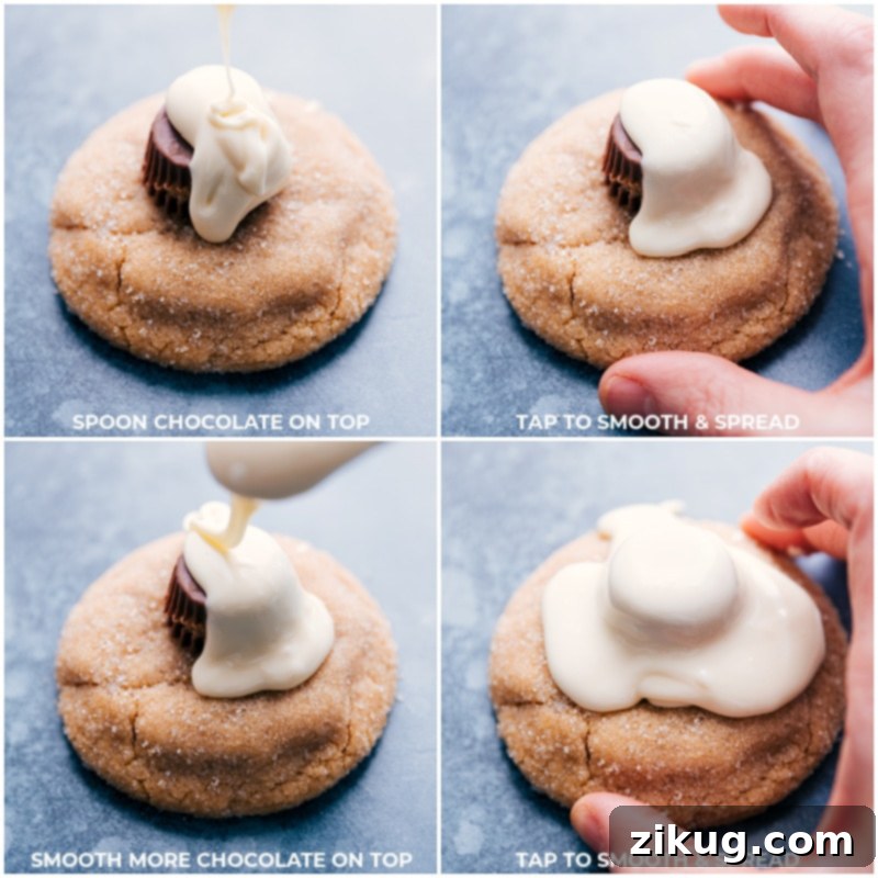 Detailed process shot of white chocolate being carefully spooned over the peanut butter cup layer on a cookie, creating a melted snow effect.