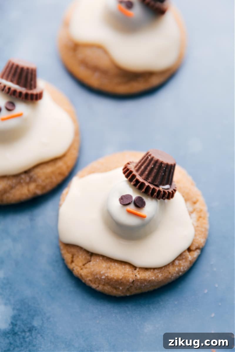 Overhead image of a batch of beautifully finished Melted Snowman Cookies, artfully arranged and ready to be served at a holiday party.