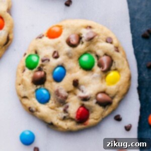 Ultimate Chocolate Chip M and M Cookies 2 Perfectly baked Chocolate Chip M&M Cookies with visible M&M's and chocolate chips, arranged on a cooling rack.