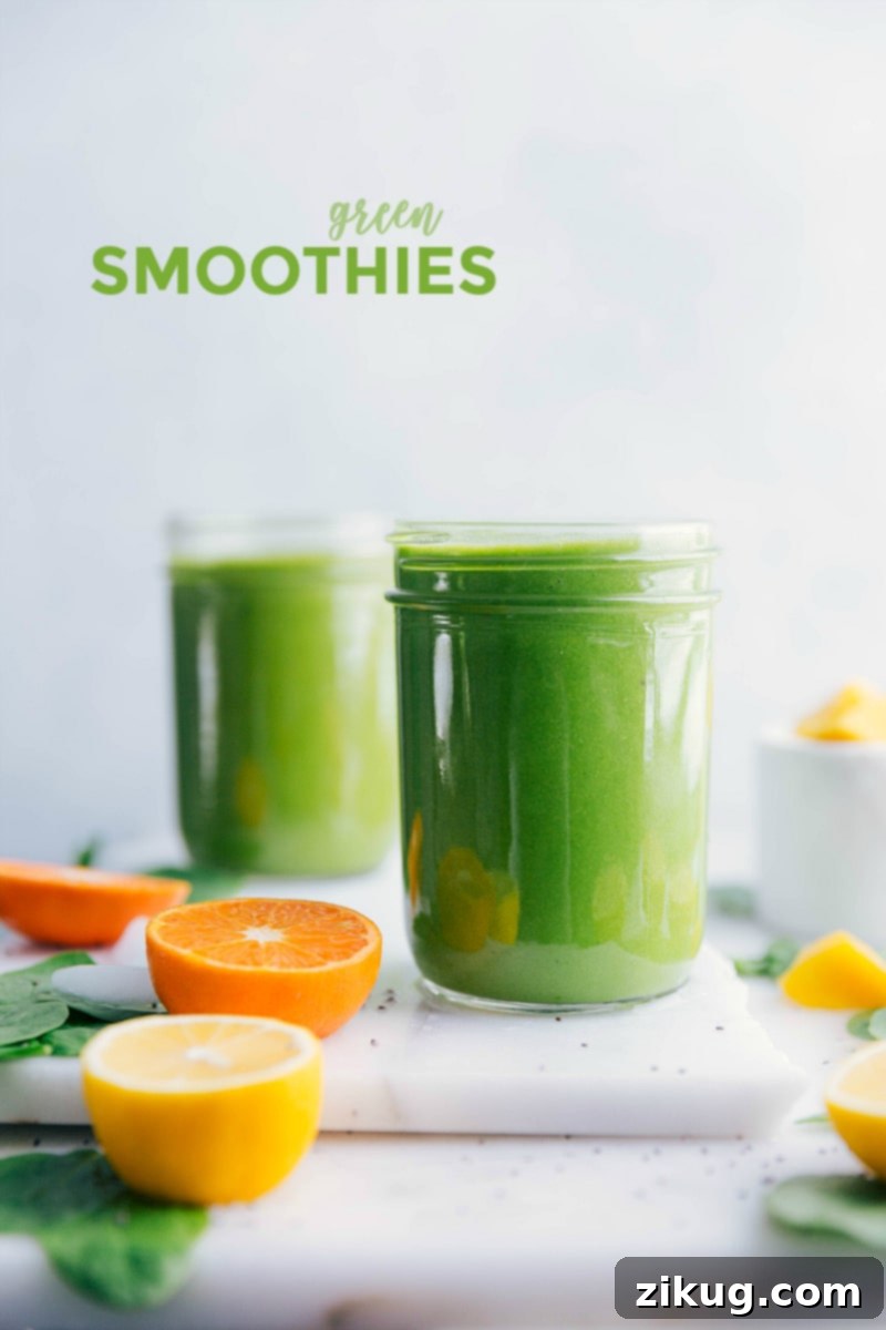 Two glasses of vibrant green smoothie adorned with fresh citrus slices, artfully arranged on a rustic wooden table, embodying a fresh and healthy lifestyle.