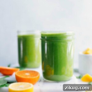 A vibrant green smoothie in a glass, ready for enjoyment, representing the healthy recipe.