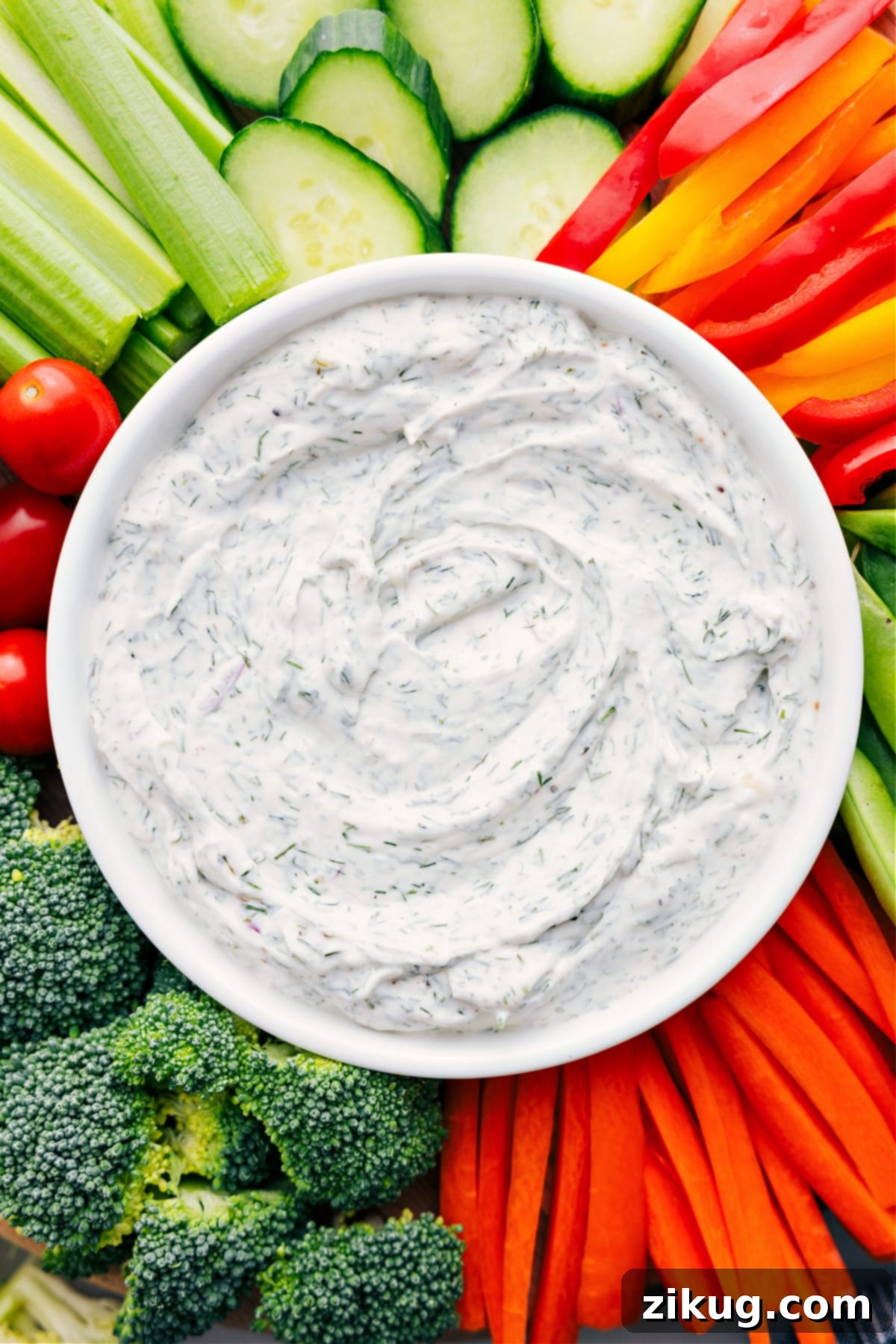 The Best Creamy Veggie Dip Recipe A vibrant bowl of homemade veggie dip, surrounded by a colorful array of fresh vegetables like carrots, bell peppers, and cucumbers, ready for a delightful dipping experience.