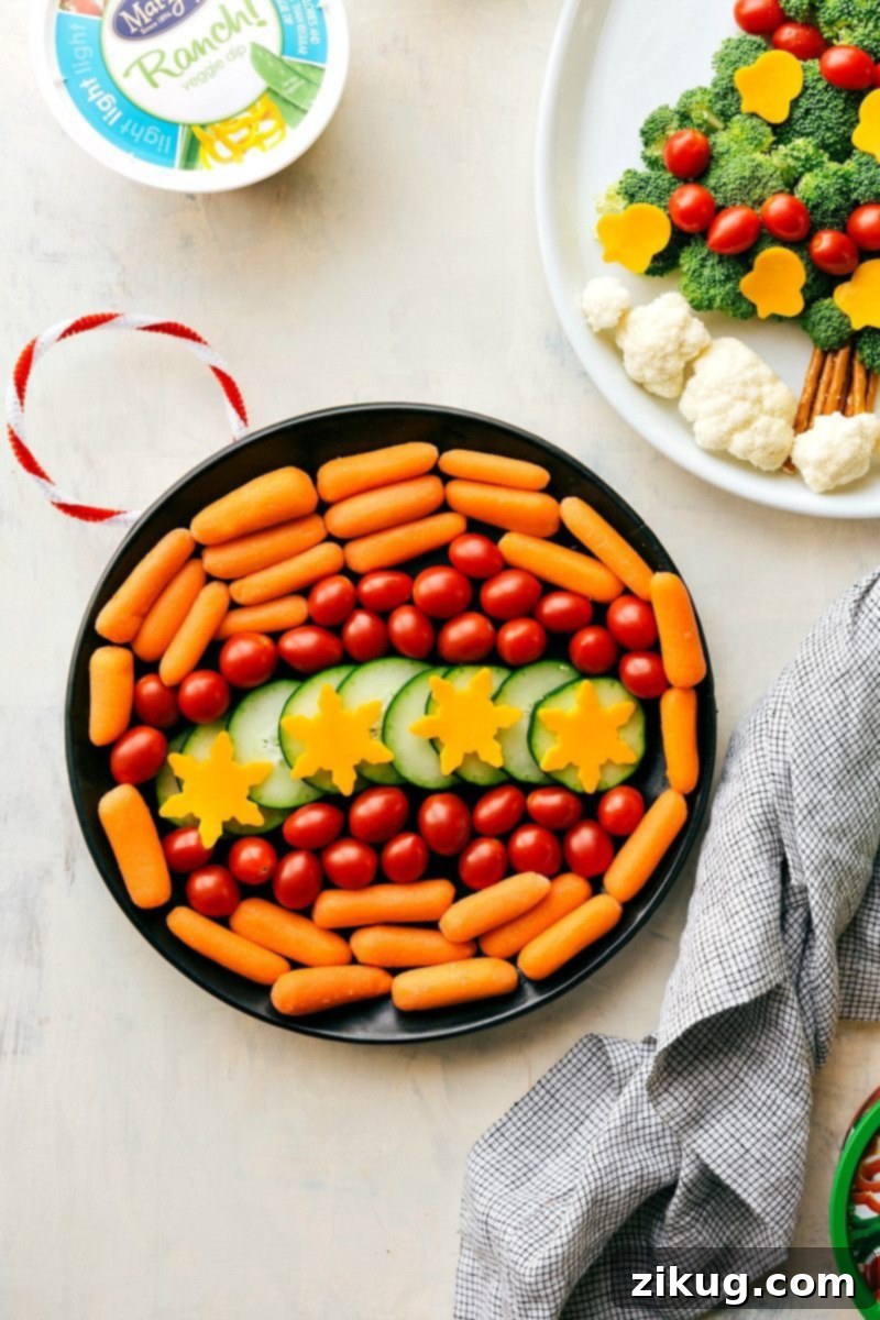 Vegetable Ornament Dip Arrangement for Holidays An elegant holiday appetizer: fresh vegetables artfully arranged in a circular pattern to resemble a Christmas ornament, served with a tasty dip.
