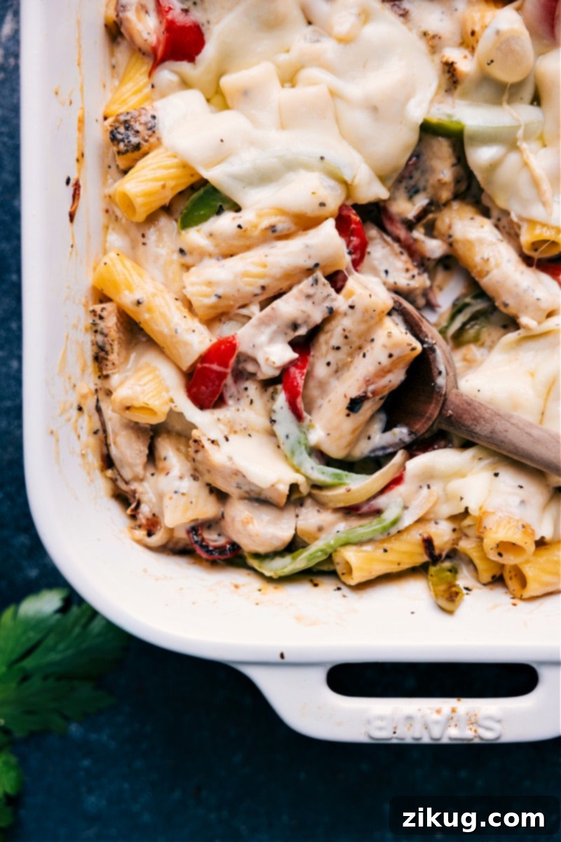 Closeup view of Baked Ziti with Chicken, showing melted cheese and tender pasta
