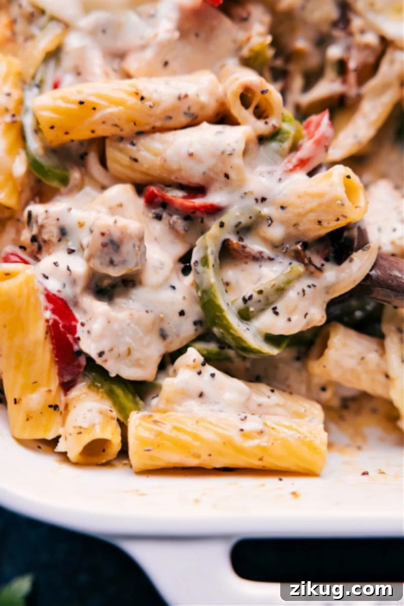 Another closeup view of Baked Ziti With Chicken, showcasing its cheesy texture