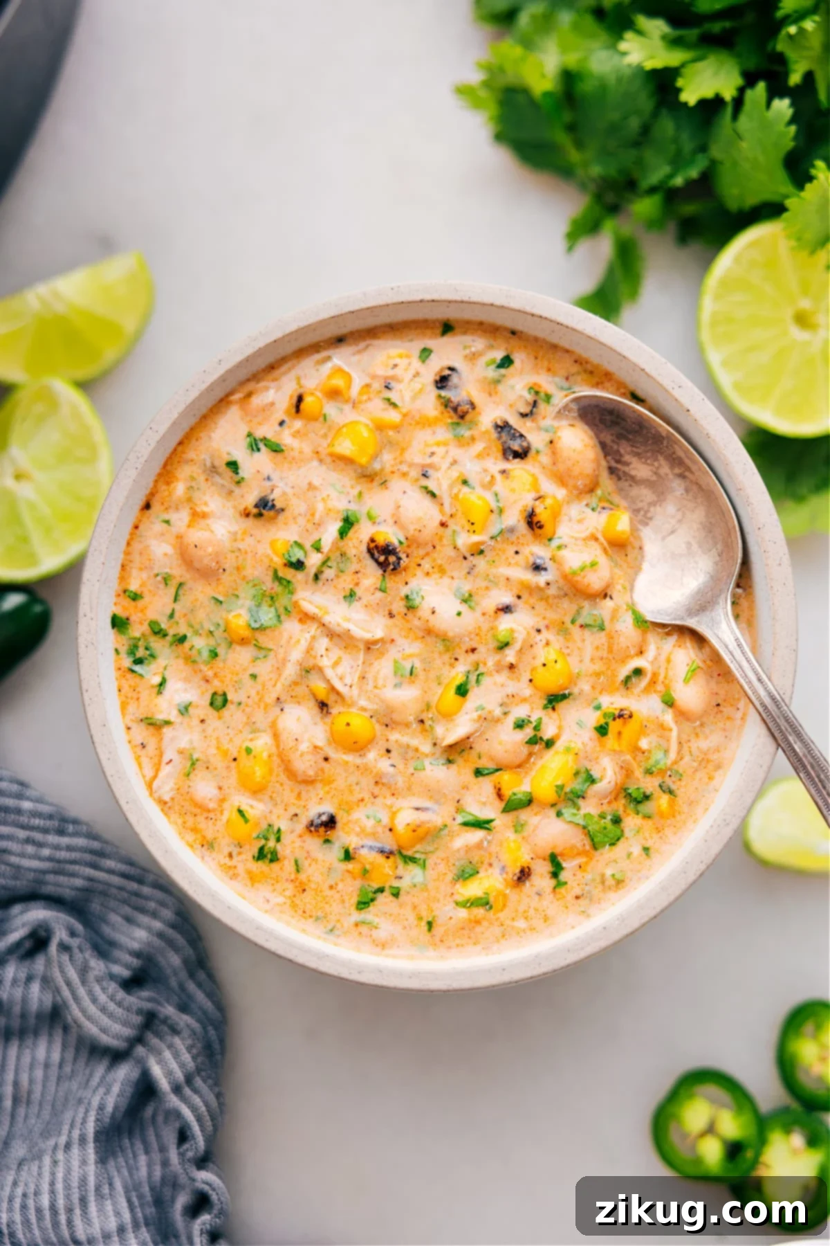 The Best And Easiest Crockpot White Chicken Chili Recipe Serve the crockpot white chicken chili in a bowl, garnished with fresh cilantro and lime, ready to enjoy.