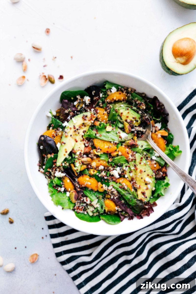 Overhead image of a beautifully arranged Citrus Quinoa Salad in a serving bowl, showcasing its vibrant ingredients.