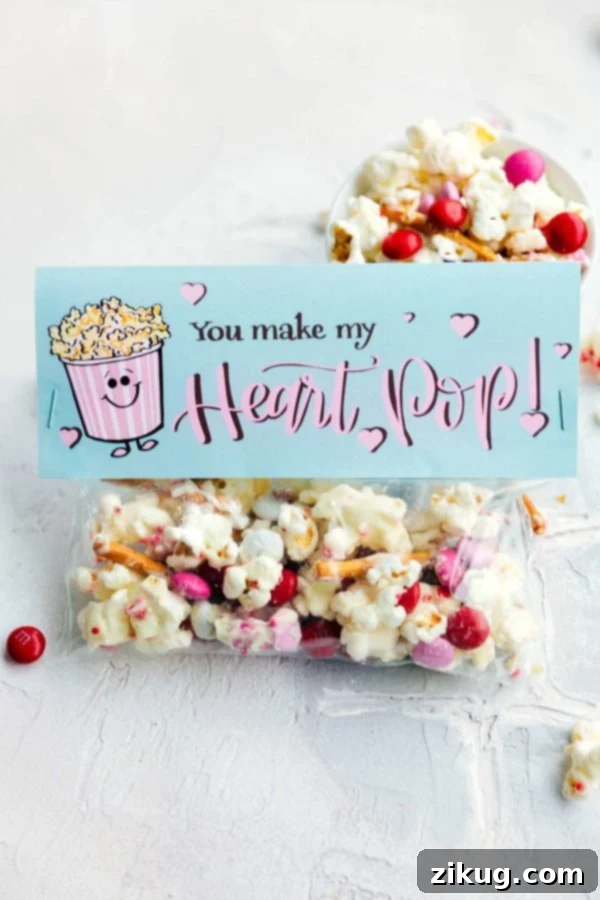 Valentine's Day Gifting Made Simple 4 Colorful 'You Make My Heart Pop' white chocolate popcorn gift bag with a playful heart-themed printable topper